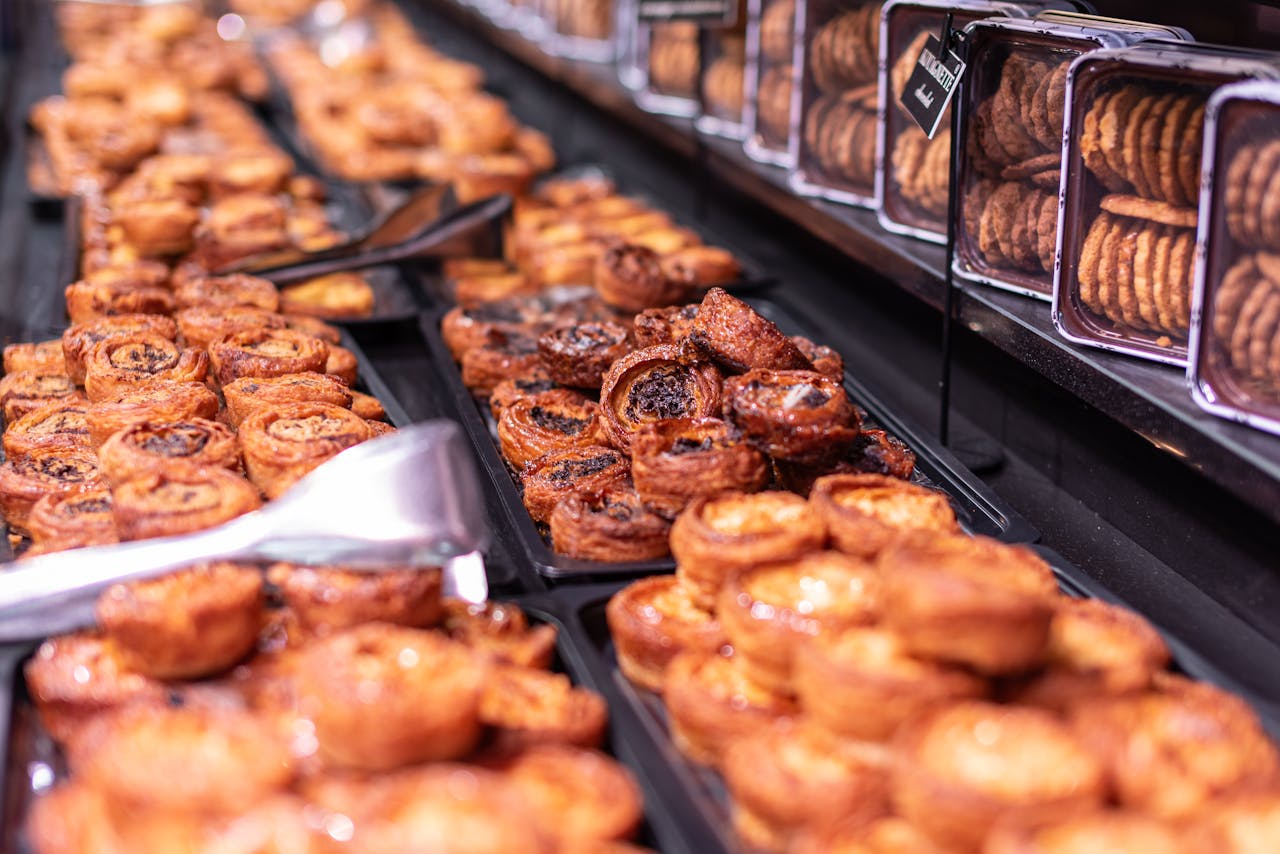 Crafted pastries and cookies on display in a Parisian bakery, evoking the charm of French culinary traditions.